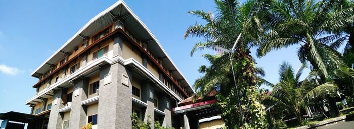 Low angle view of building against blue sky