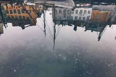 Reflection of buildings in puddle