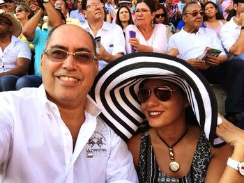 Portrait of smiling couple at bullfighting stadium