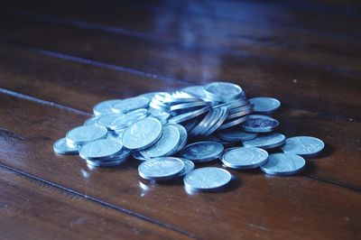 High angle view of coins on table