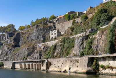 View of dam on mountain against sky