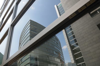 Low angle view of modern buildings against sky