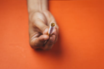 Close-up of hand holding ring