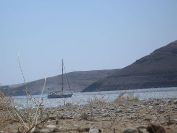 Scenic view of calm sea against clear sky