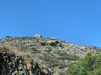 Scenic view of rocky mountains against clear blue sky