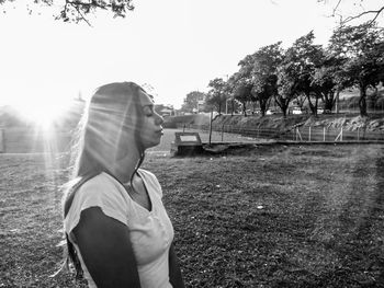 Side view of man looking at field