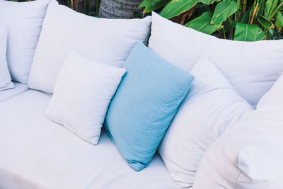 High angle view of cushions on sofa at back yard