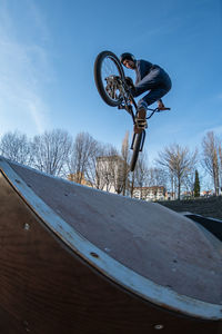 Low section of man riding bicycle