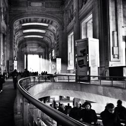 People walking on railroad station platform