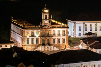 Buildings in city at night