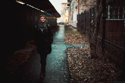 Portrait of smiling young woman standing outdoors