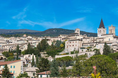 View of town against blue sky
