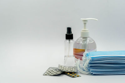 Close-up of bottle on table against white background