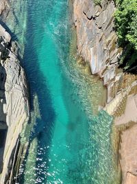 High angle view of rock formation by sea