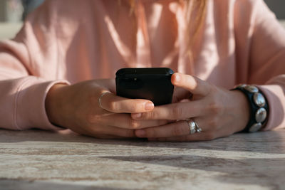 Close-up of woman using mobile phone