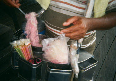 Midsection of man preparing food