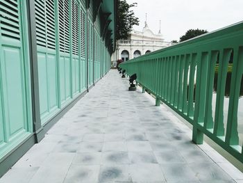 Man in city against sky