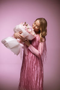 Portrait of woman holding bouquet