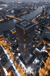 High angle view of illuminated buildings in city