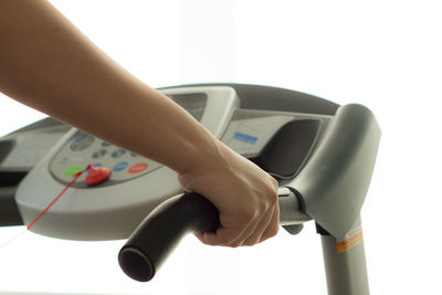 Close-up of woman hand over white background