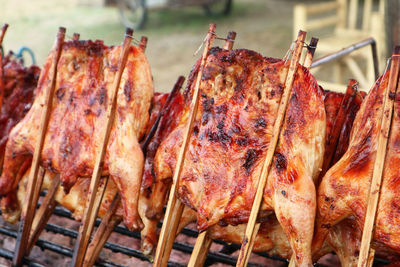 High angle view of meat on barbecue grill