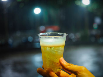 Close-up of hand holding drink