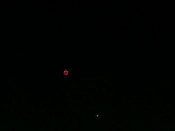 Scenic view of moon against sky at night