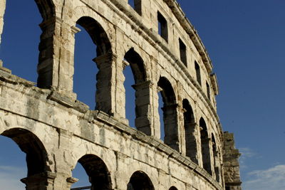 Low angle view of old ruin against clear sky