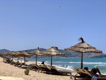 Panoramic view of beach against clear sky