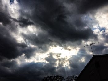 Low angle view of building against cloudy sky