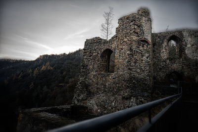 Low angle view of old ruin against sky