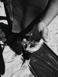 Close-up of young woman holding hands