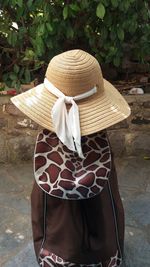 Rear view of woman wearing hat