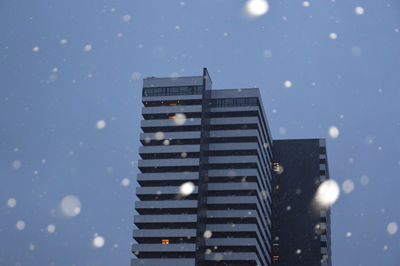 Low angle view of building against sky at dusk