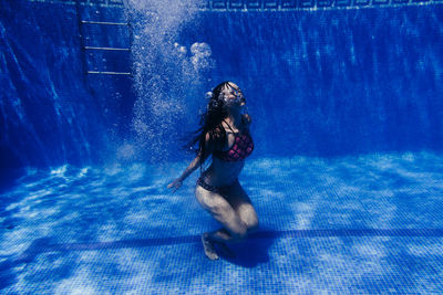 Portrait of woman in swimming pool