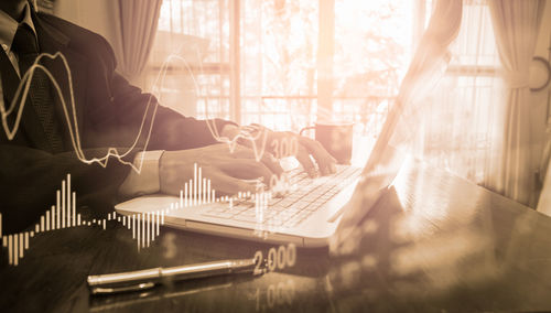 Man working on table in room