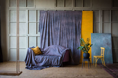 Empty sofa and table against wall at home