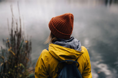 Rear view of woman looking at lake