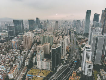 High angle view of modern buildings in city against sky