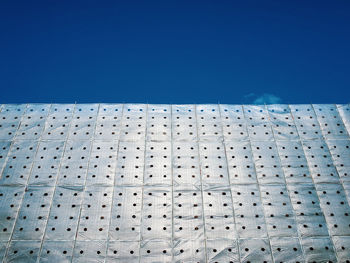 Low angle view of building against clear blue sky