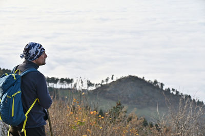 Hiker standing on mountain