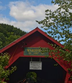 Text on building against sky