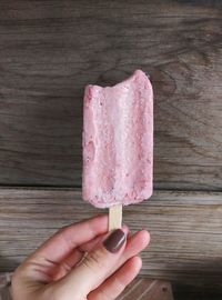 Cropped hand holding ice cream