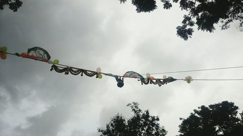 Low angle view of matki hanging during dahi handi