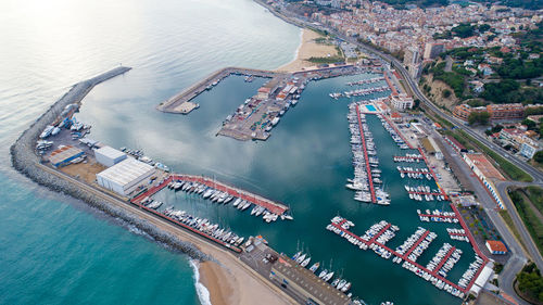 High angle view of commercial dock by sea in city