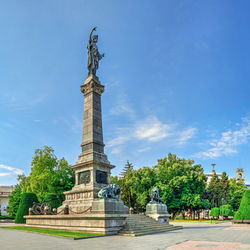 Low angle view of statue against sky