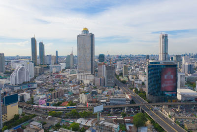 High angle view of modern buildings in city against sky