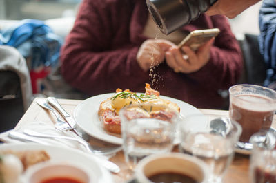 Close-up of seasoning salt on food at restaurant