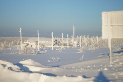 Panoramic view of snow covered trees against sky