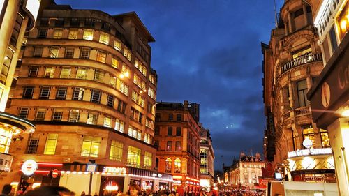 Low angle view of illuminated buildings at night